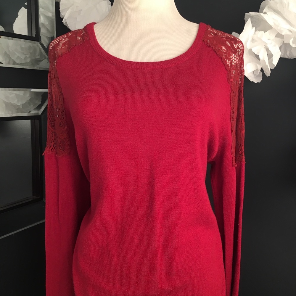 Maroon sweater with shoulder lace detail.